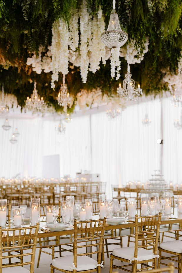 Wedding Reception Withe Golden Decoration with white flowers cascading from the ceiling and cancle lit in San Miguel de Allende Mexico / details photographer