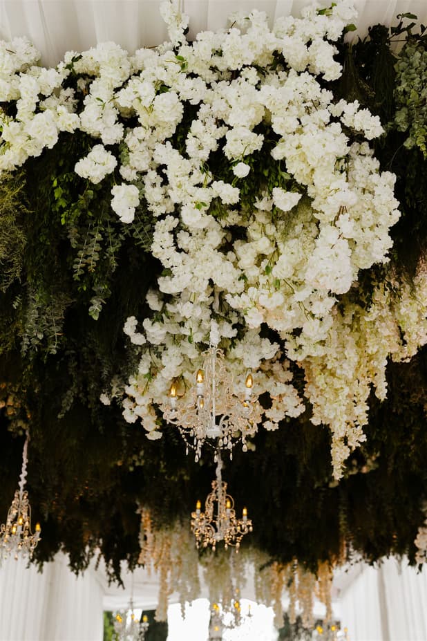 Wedding Reception Withe Golden Decoration with chandeliers, white flowers cascading from the ceiling and cancle lit in San Miguel de Allende Mexico / details photographer
