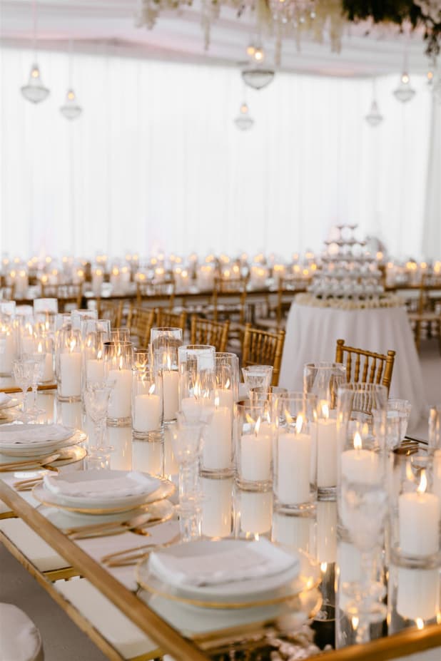 Wedding Reception Withe Golden Decoration with white flowers cascading from the ceiling and cancle lit in San Miguel de Allende Mexico / details photographer