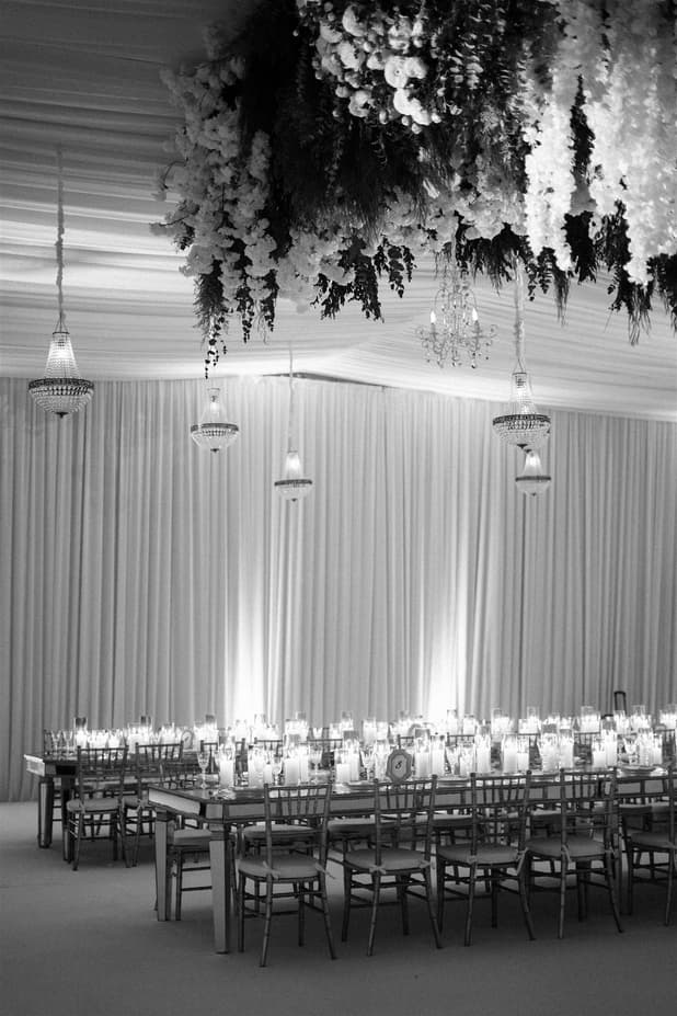 Wedding Reception Withe Golden Decoration with white flowers cascading from the ceiling and cancle lit in San Miguel de Allende Mexico / details photographer
