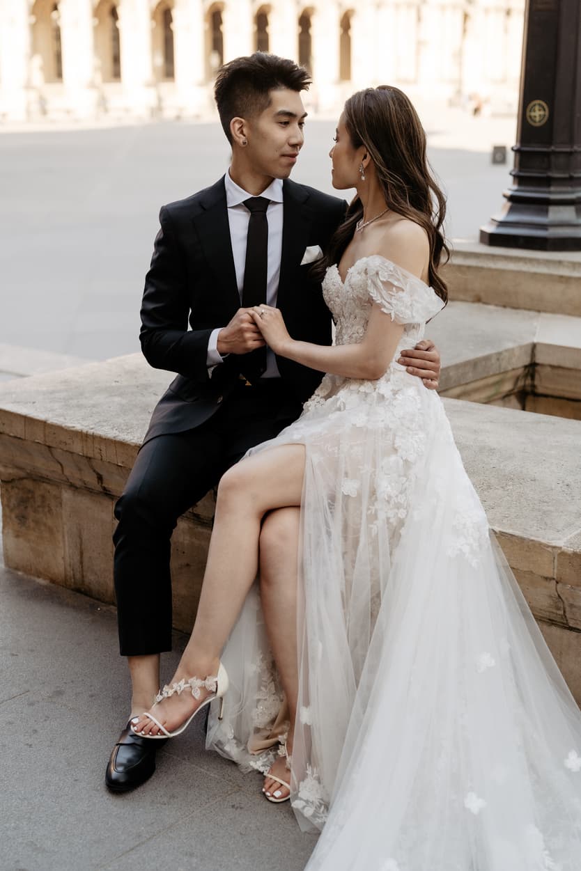 Bride in Martina Liana wedding dress Paris and Rene Caovilla heels