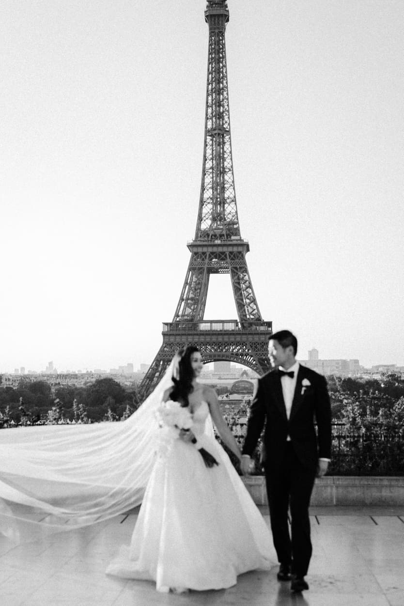 Bride wearing Monique Lhuillier for her pre wedding in Paris at Place Trocadéro with Eiffel Tower view