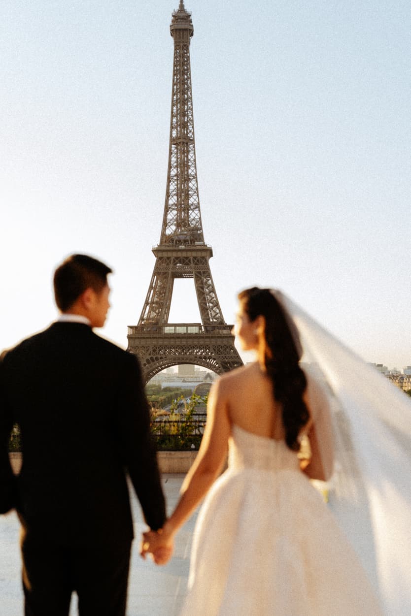 Bride wearing Monique Lhuillier for her pre wedding in Paris at Place Trocadéro with Eiffel Tower view