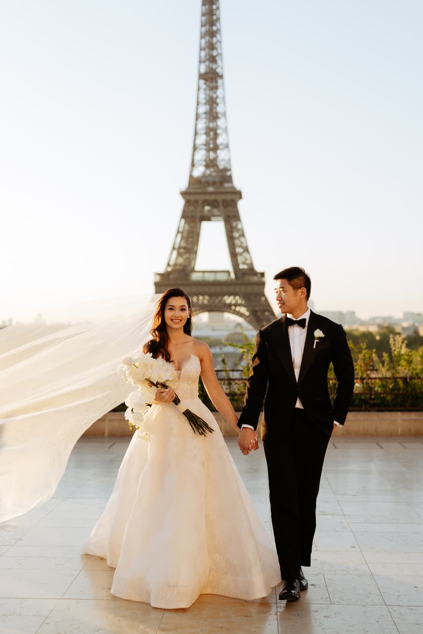 Bride wearing Monique Lhuillier for her pre wedding in Paris at Place Trocadéro with Eiffel Tower view