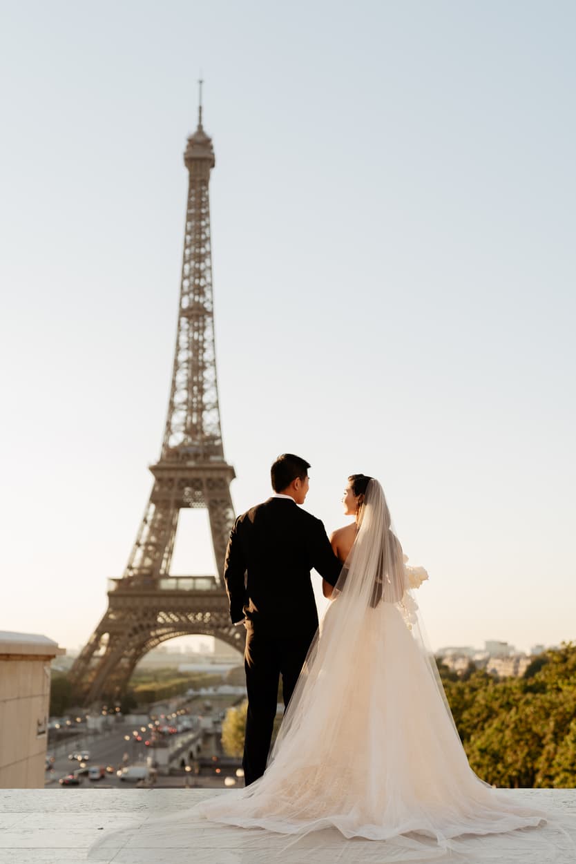 Bride wearing Monique Lhuillier for her pre wedding in Paris at Place Trocadéro with Eiffel Tower view