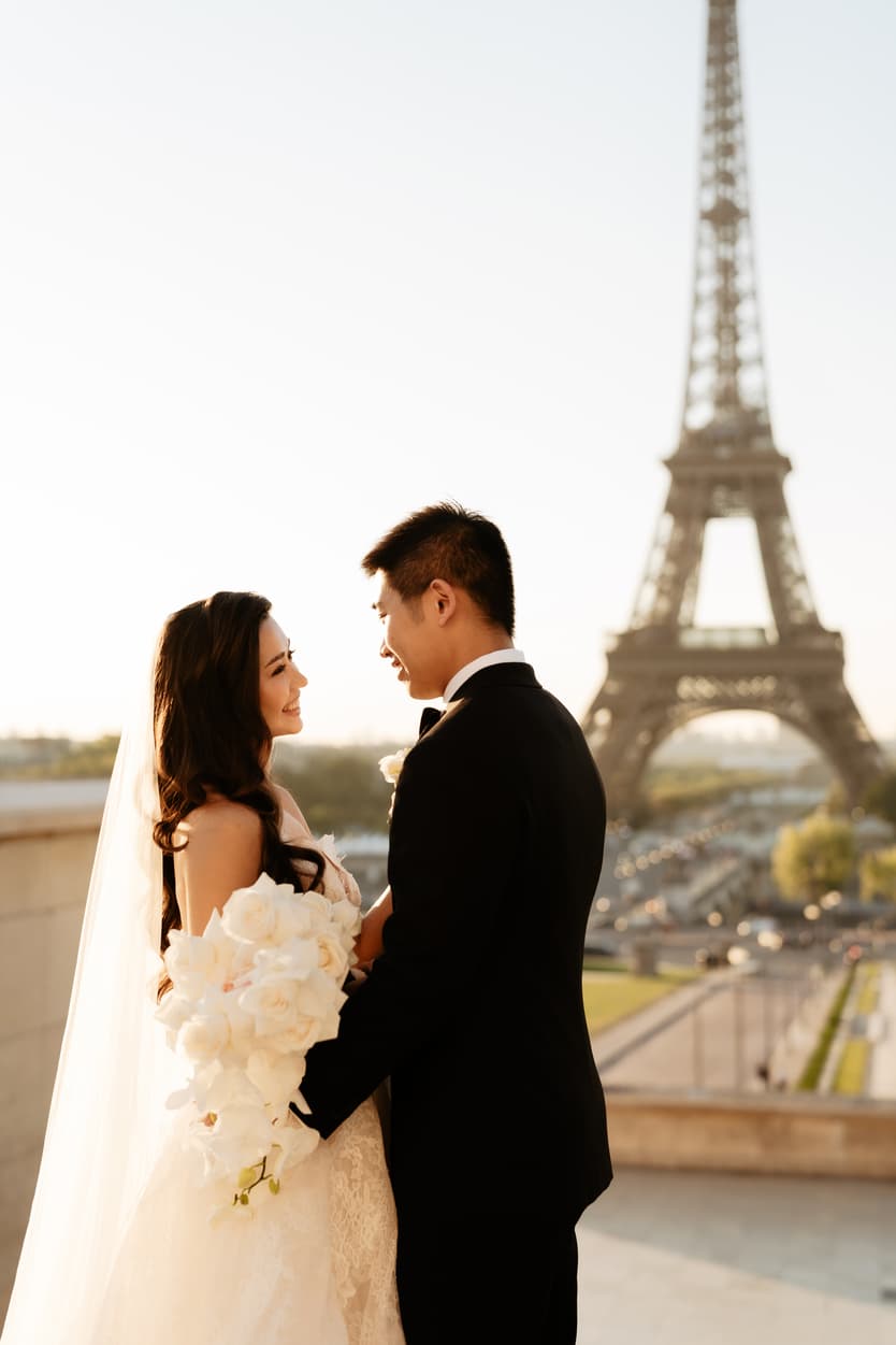 Bride wearing Monique Lhuillier for her pre wedding in Paris at Place Trocadéro with Eiffel Tower view