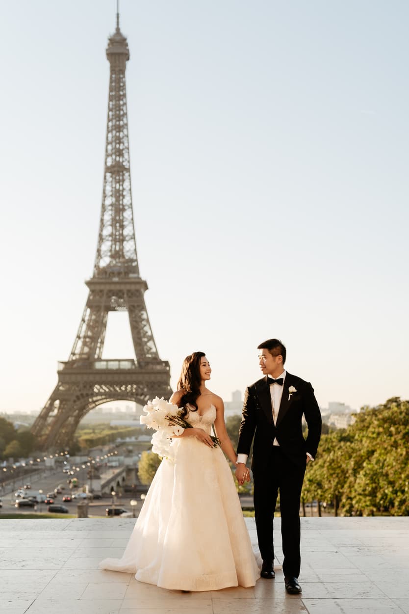 Bride wearing Monique Lhuillier for her pre wedding in Paris at Place Trocadéro with Eiffel Tower view