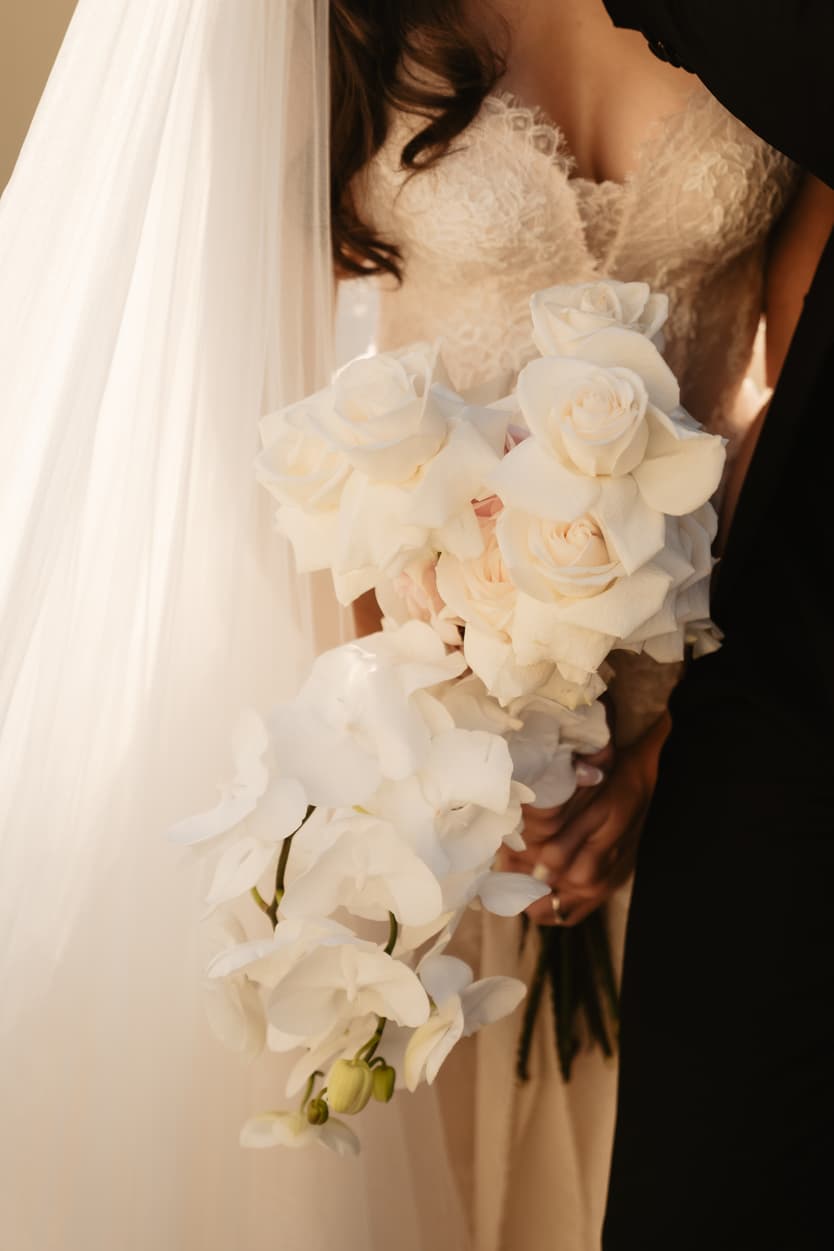 Orchid flower bouquet and Bride wearing Monique Lhuillier for her pre wedding in Paris at Place Trocadéro with Eiffel Tower view