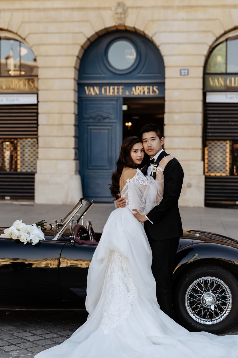 bride wearing Galia Lahav for her wedding in Paris at Place Vendome vintage car