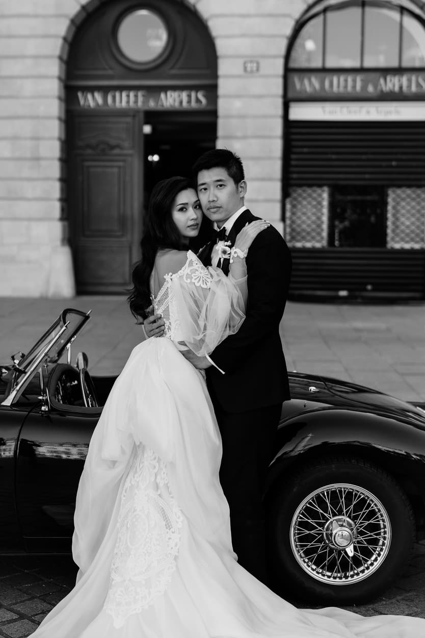 bride wearing Galia Lahav for her wedding in Paris at Place Vendome vintage car