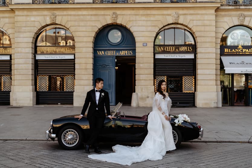 bride wearing Galia Lahav for her wedding in Paris at Place Vendome vintage car