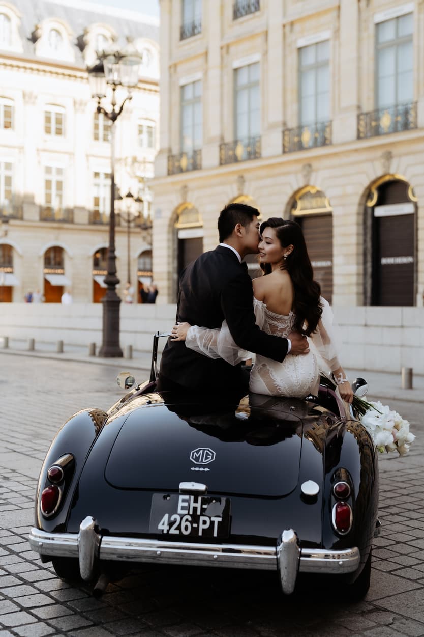 bride wearing Galia Lahav for her wedding in Paris at Place Vendome vintage car