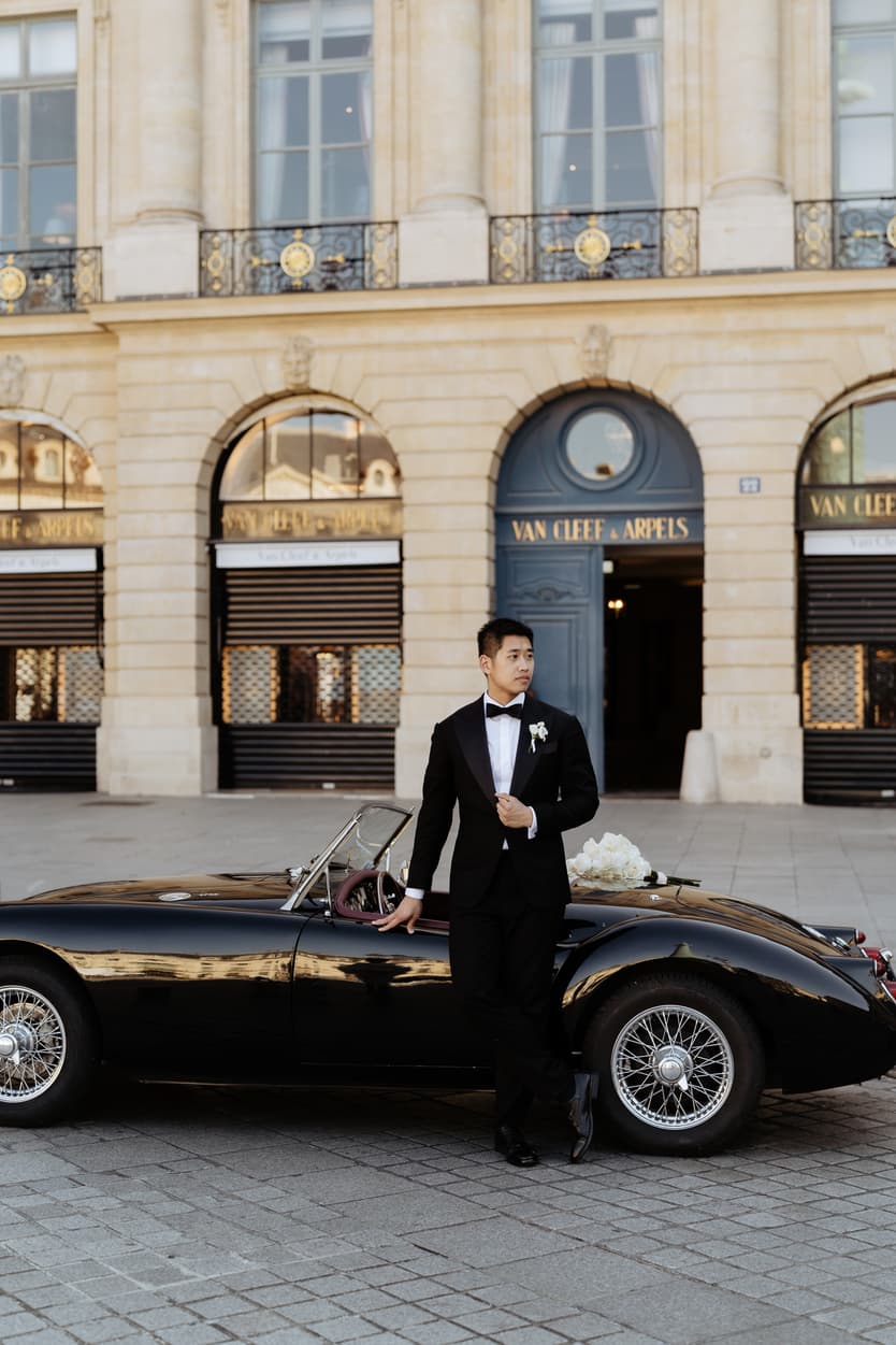 bride wearing Galia Lahav for her wedding in Paris at Place Vendome vintage car