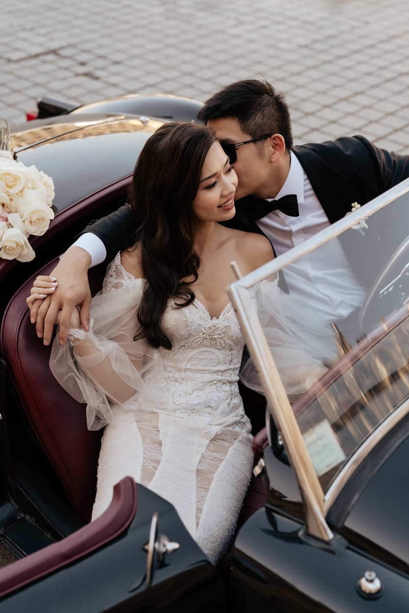 bride wearing Galia Lahav for her wedding in Paris at Place Vendome vintage car