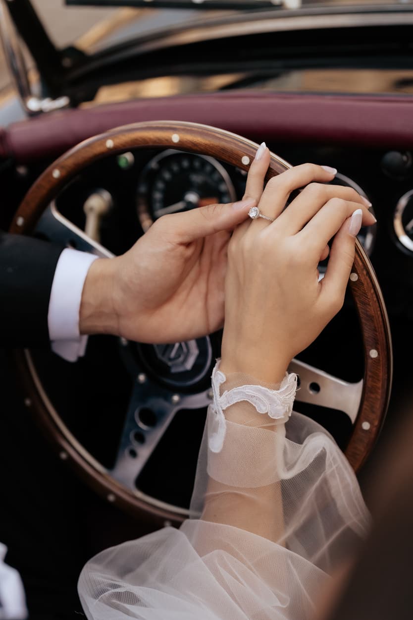 bride wearing Galia Lahav for her wedding in Paris at Place Vendome Vintage car with ring close up