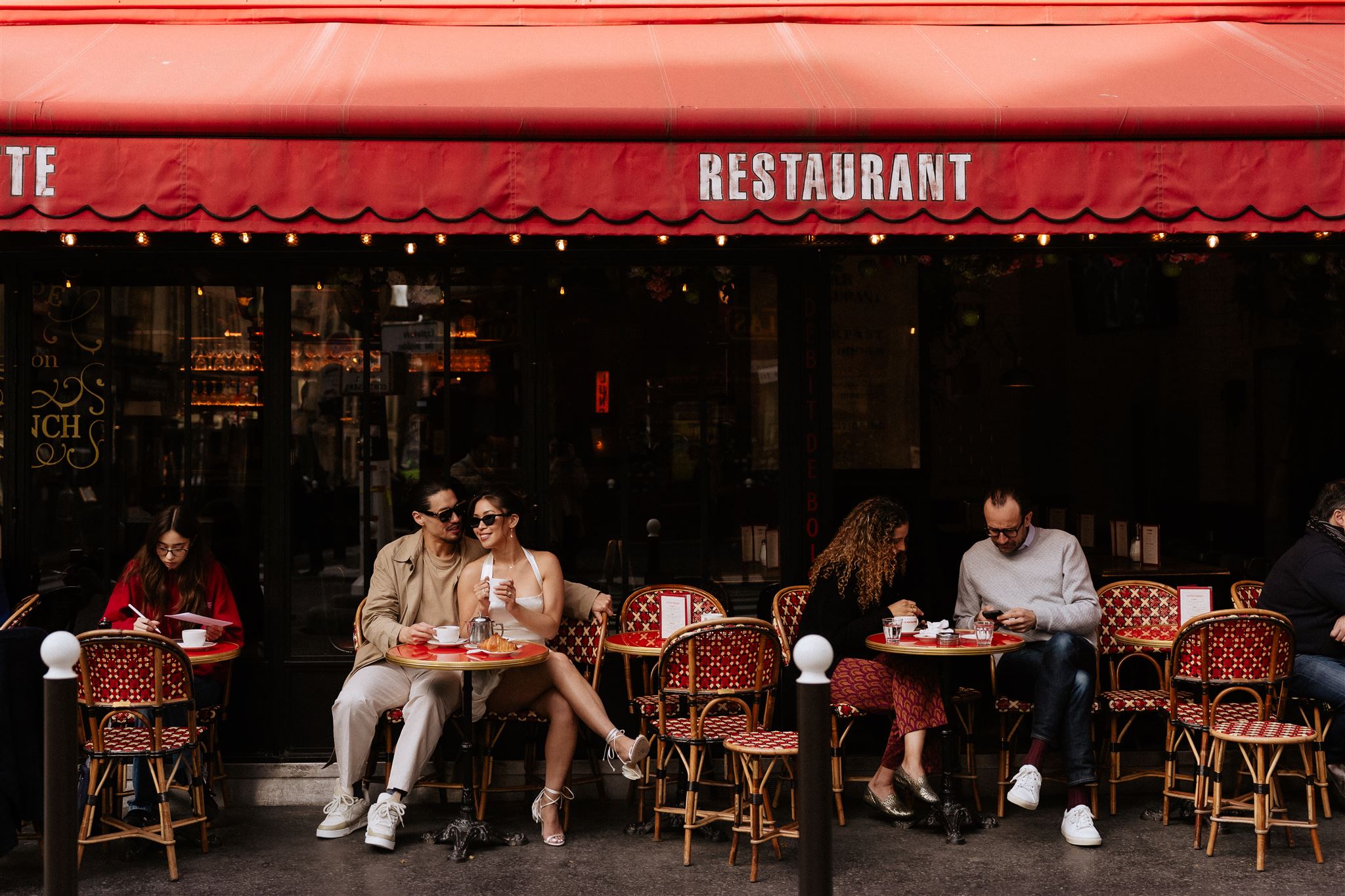 paris engagement photos at a cafe