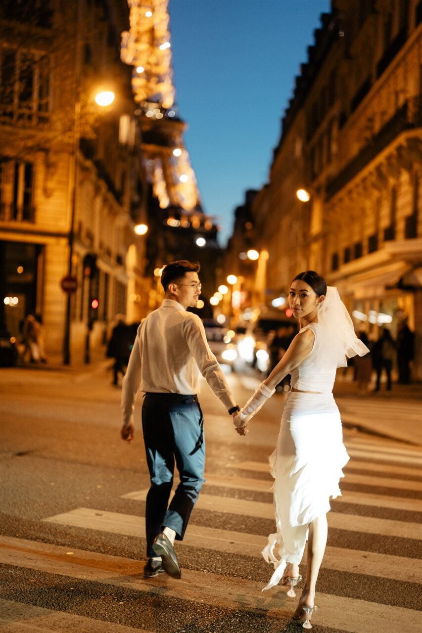 Couple walking while holding hands romantic pre-wedding Paris