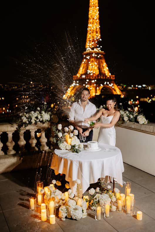Shangrila Eiffel tower terrace elopement bride groom popping champagne