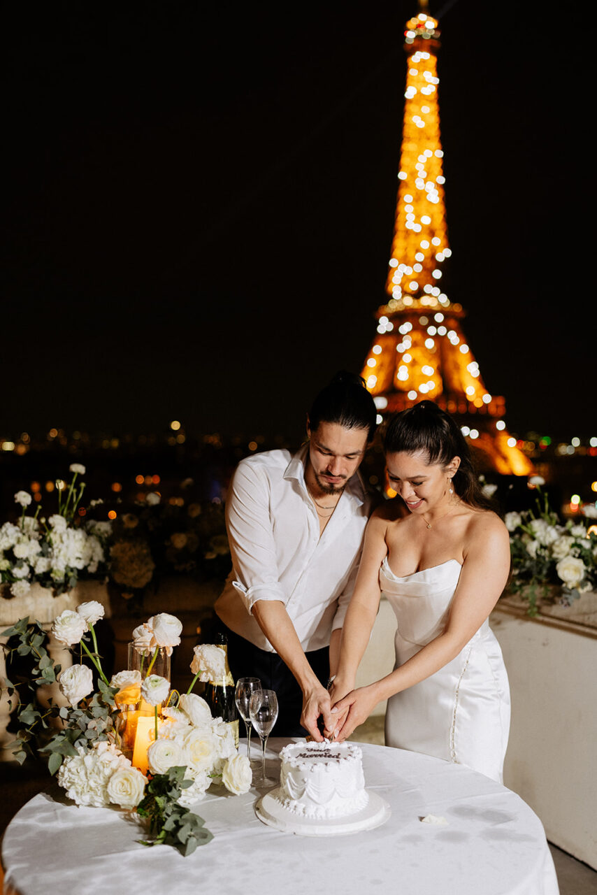 Eiffel tower sparkling terrace elopement cutting cake