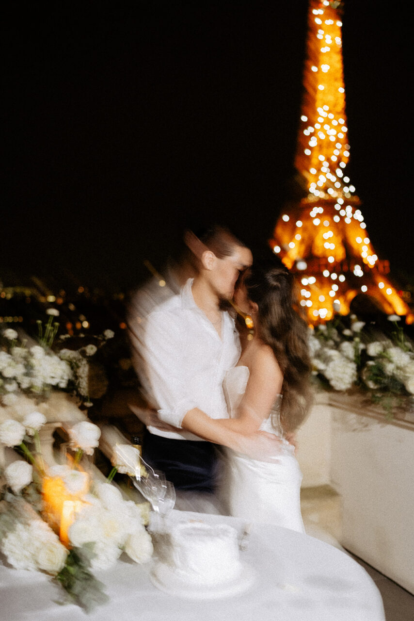 Eiffel tower sparkling terrace elopement bride groom kissing