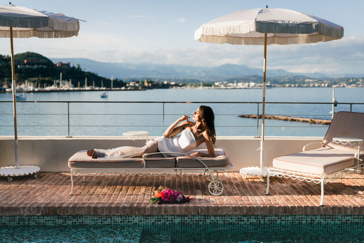 Elopement at Chateau Theoule in the South of France bride laying down in poolside lounge