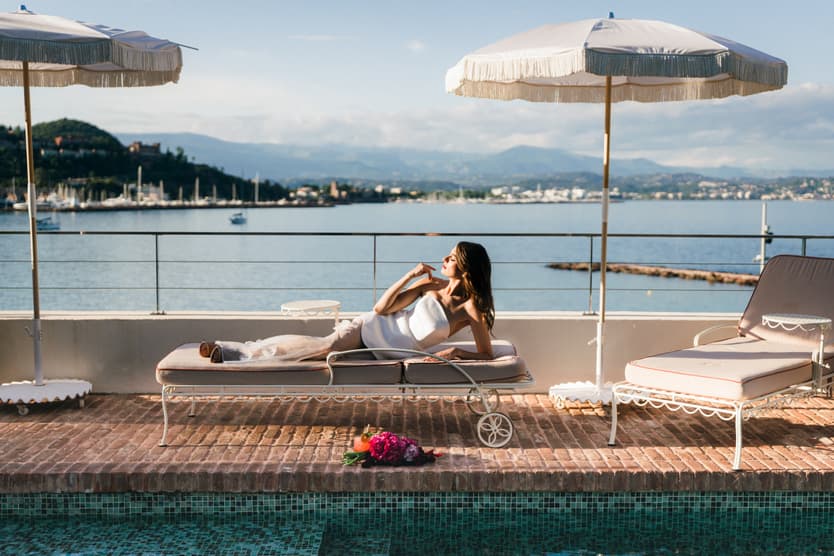 Elopement at Chateau Theoule in the South of France bride laying down in poolside lounge